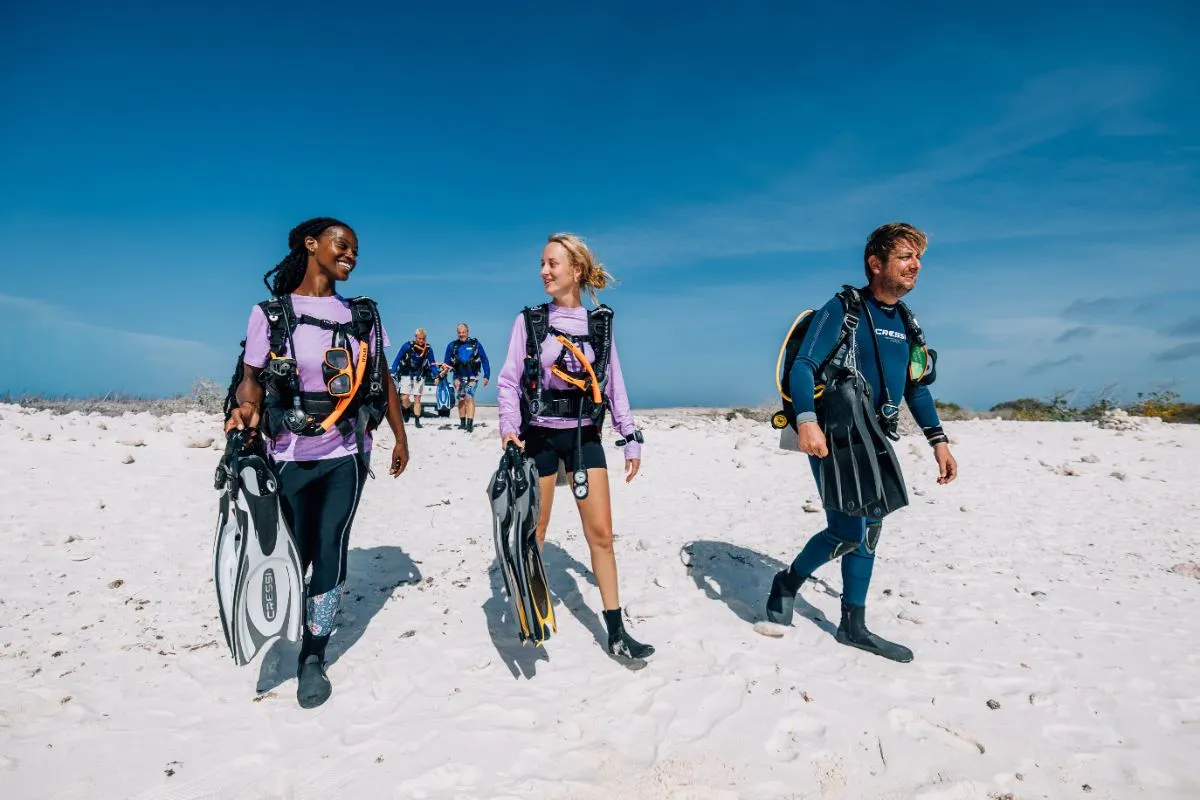 Divers on the beach before a shore dive